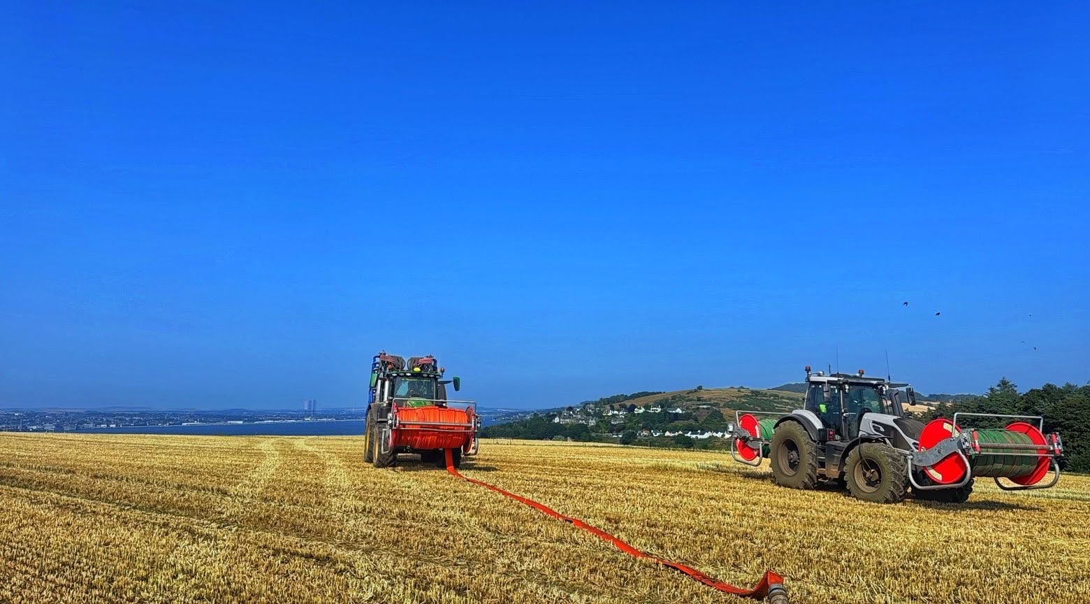 Tractor and trailer in a field